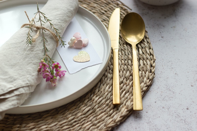 Table setting with a plate a knife and a spoon, biblical hospitality