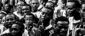 crowd of young black men, does God really love everyone