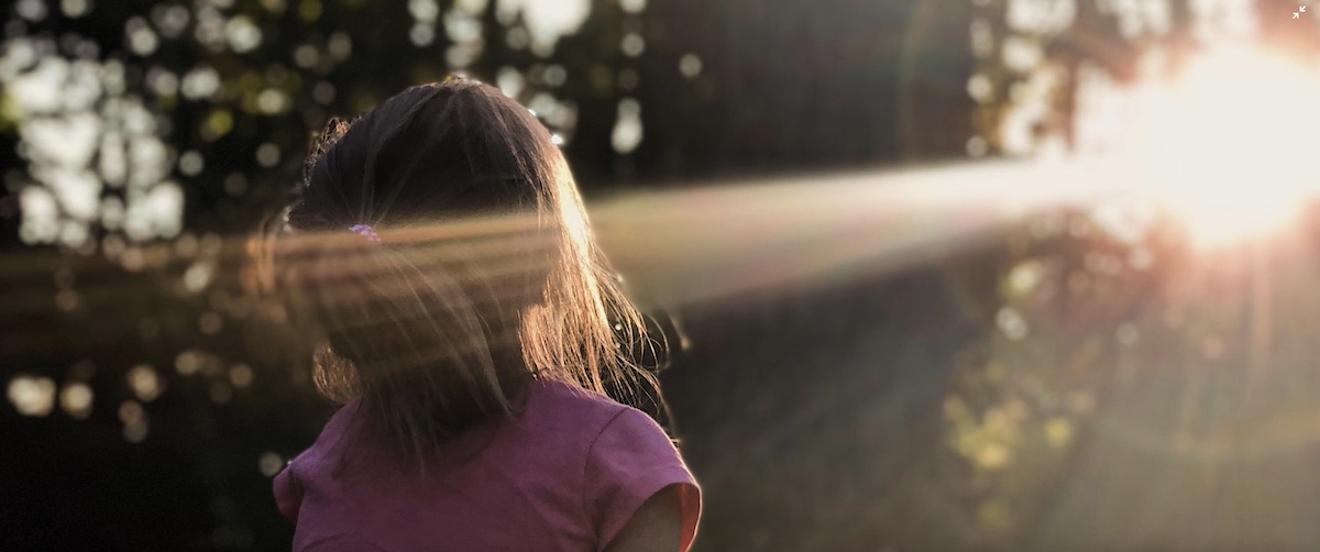 girl in sunlight, surrendering to Christ,