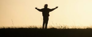 man giving thanks in sunset, overflow with gratitude