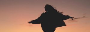 girl dancing in the sunset, dancing with God