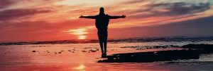 man on beach at sunset, freedom from guilt, freedom from guilt and shame