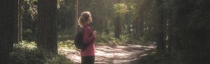 woman looking at trees, face to face with God