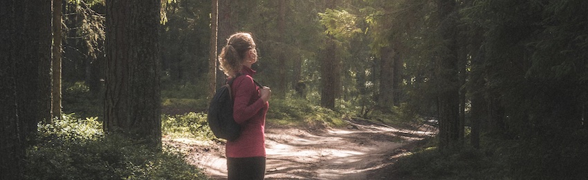 woman looking at trees, face to face with God