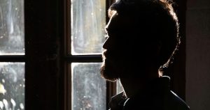 silhouette of man at window, overcoming temptation