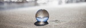 glass ball on beach, spiritual identity