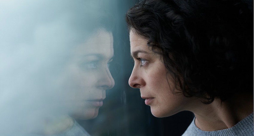 woman looking at her reflection, accept responsibility