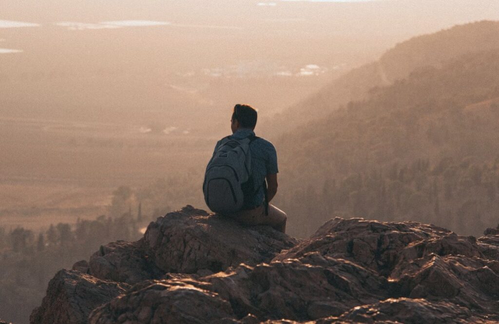 man sitting on rocky outcrop, Biblical basis